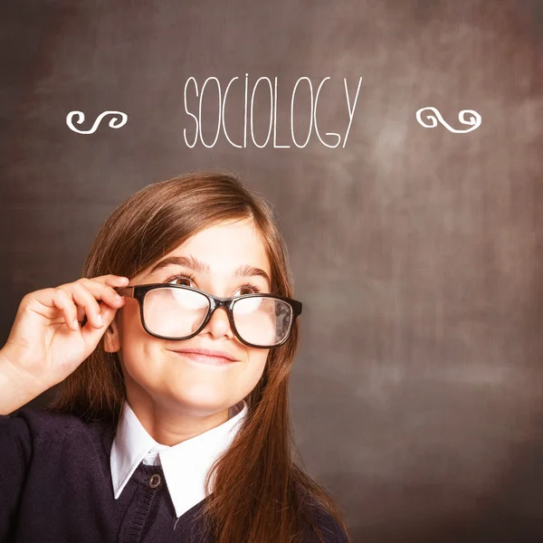 Word sociology against cute pupil — Stock Photo, Image