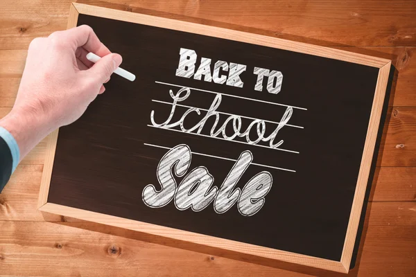 Composite image of hand writing with a white chalk — Stock Photo, Image