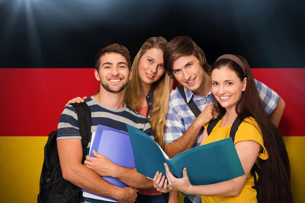 Students holding folders at college — Stock Photo, Image