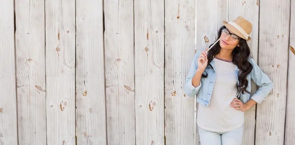 Pretty brunette thinking and smiling — Stock Photo, Image