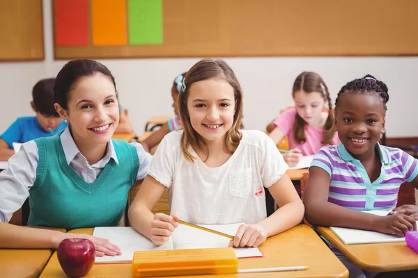 Teacher with pupils during class — Stock Photo, Image