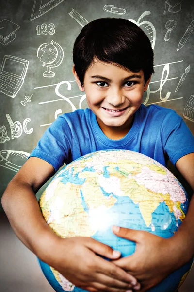 Cute little boy holding globe — Stock Photo, Image