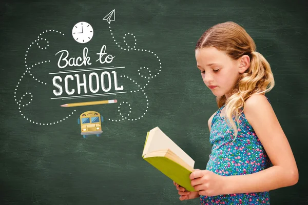 Girl reading book in library — Stock Photo, Image