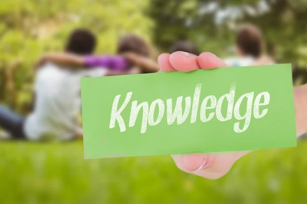Word knowledge and hand showing card — Stock Photo, Image