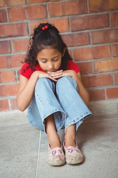 Upset lonely girl sitting by herself — Stock Photo, Image