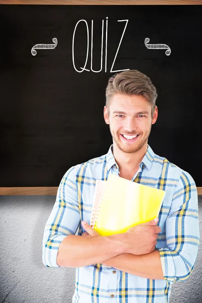 Quiz against chalkboard in classroom — Stock Photo, Image