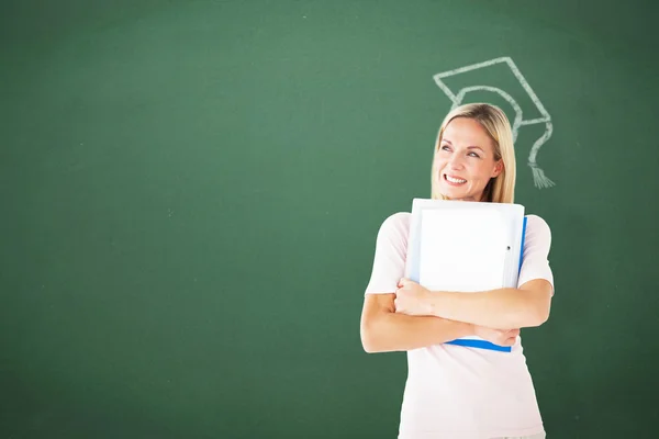 Student smiling against green — Stock Photo, Image