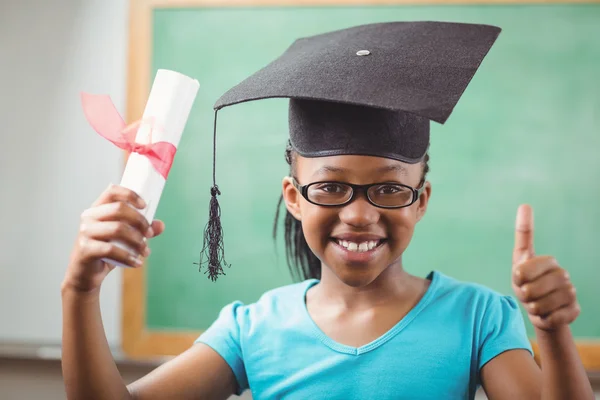 Pupil with mortar board doing thumbs up — Stock Photo, Image