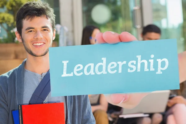 Leadership against happy student smiling at camera — Stock Photo, Image