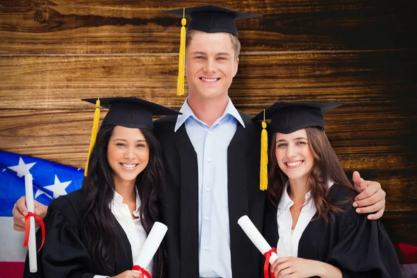 Imagen compuesta de tres amigos graduados de la universidad juntos —  Fotos de Stock