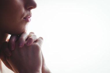 Woman praying with hands together clipart