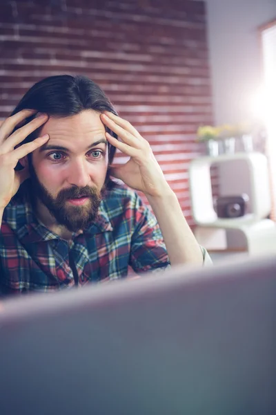 Shocked businessman with head in hand — Stock Photo, Image