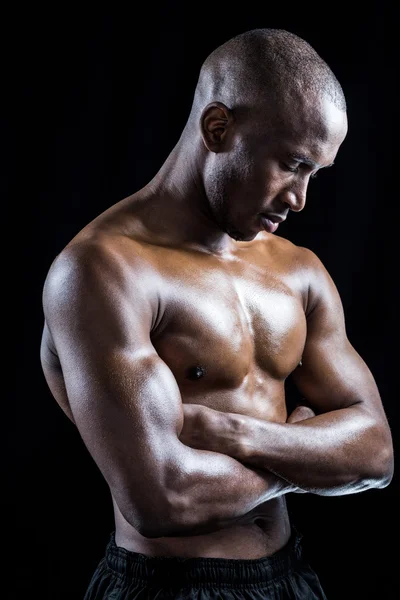 Shirtless athlete standing with arms crossed — Stock Photo, Image