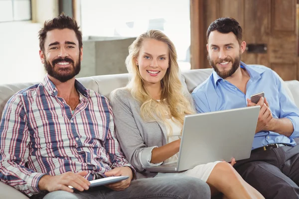 Happy colleagues using technologies — Stock Photo, Image