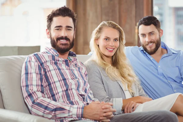 Colleagues sitting on sofa — Stock Photo, Image