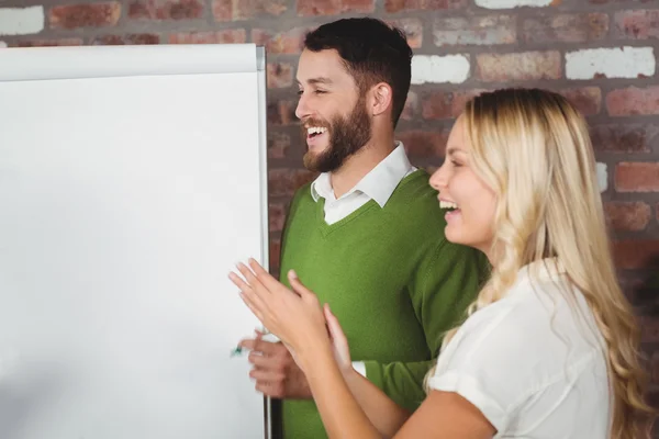 Businesswoman clapping in office — Stock Photo, Image