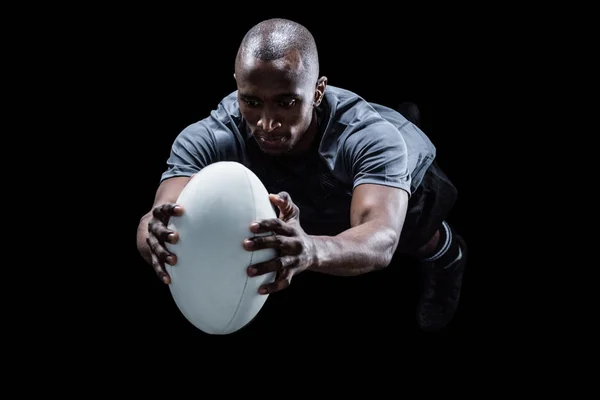 Jugador de rugby captura de pelota — Foto de Stock