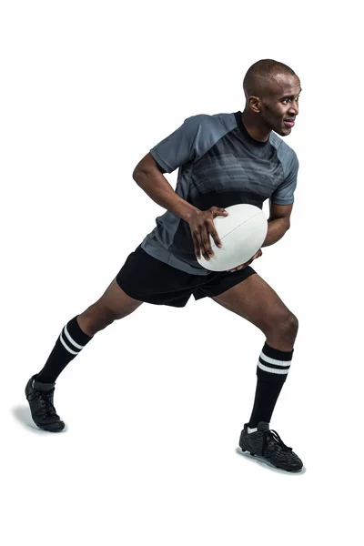 Atleta tomando posição para jogar bola de rugby — Fotografia de Stock