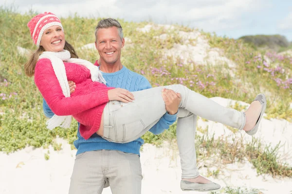 Happy man carrying a woman — Stock Photo, Image