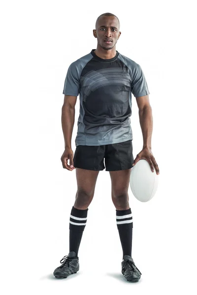 Sportif tenant une balle de rugby — Photo