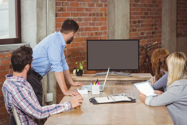 Business people looking towards screen — Stock Photo, Image