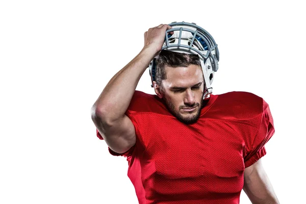 Jugador de fútbol americano en la eliminación de casco — Foto de Stock