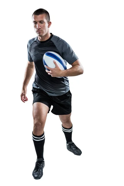 Sports player running with ball — Stock Photo, Image