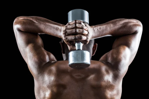 Muscular hombre levantando mancuerna — Foto de Stock