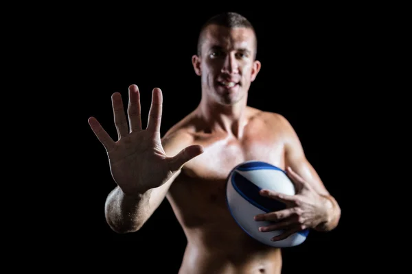 Hemdloser Sportler zeigt Hand — Stockfoto
