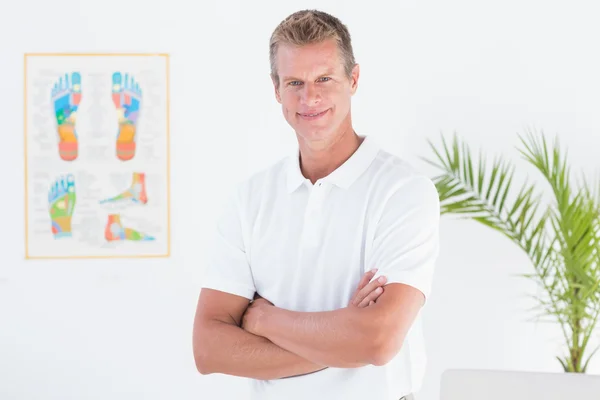 Happy doctor with arms crossed — Stock Photo, Image