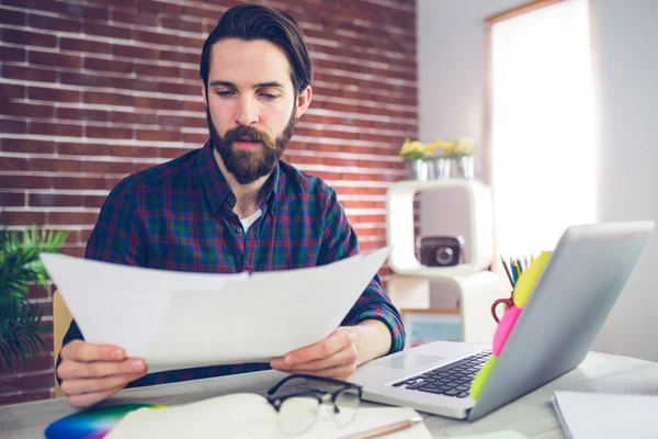 Businessman examining document — Stock Photo, Image