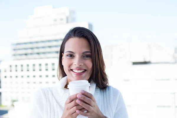 Beautiful brunette drinking a coffee — Stock Photo, Image