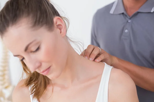 Doctor doing neck adjustment — Stock Photo, Image