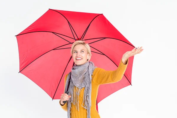 Woman checking to see if its raining — Stock Photo, Image