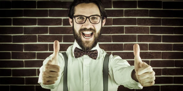 Hipster with thumbs up gesture — стоковое фото