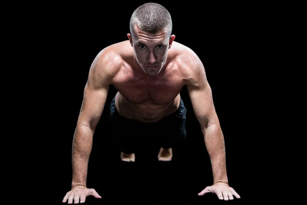 Shirtless atleet doet push ups — Stockfoto