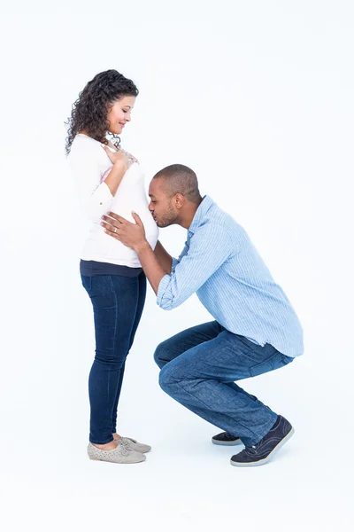 Man kissing pregnant wife belly — Stock Photo, Image