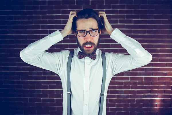 Angry man with head in hands — Stock Photo, Image