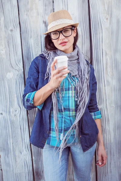 Happy hipster holding cup — Stock Photo, Image