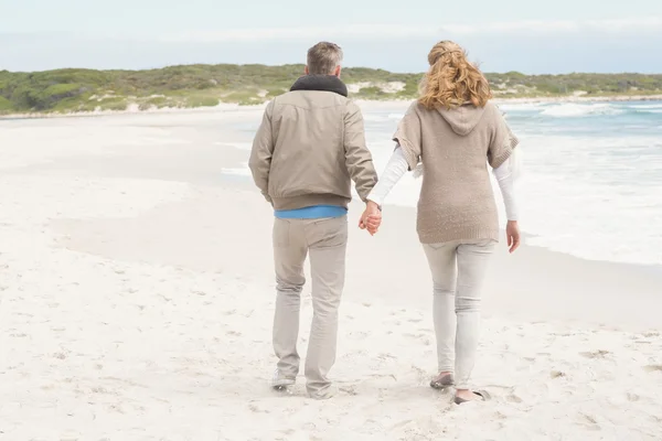 Couple holding hands while walking — Stock Photo, Image