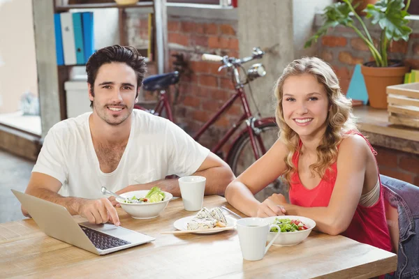 Business people with laptop in creative office — Stock Photo, Image