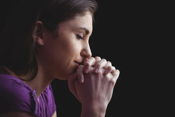 Woman praying with hands together — Stock Photo, Image