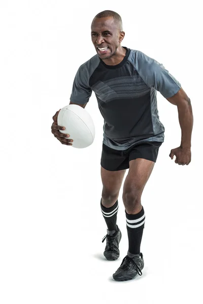 ラグビーをプレーしながら実行しているスポーツマン — ストック写真