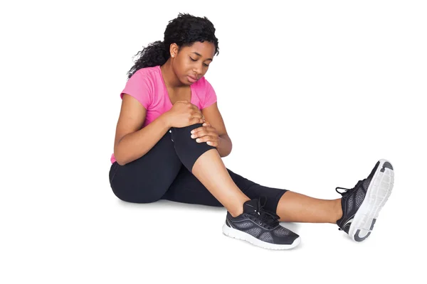 Fit woman with knee injury — Stock Photo, Image