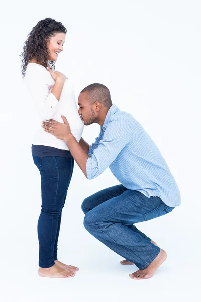 Husband kissing belly — Stock Photo, Image