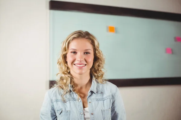 Businesswoman standing in creative office Royalty Free Stock Images