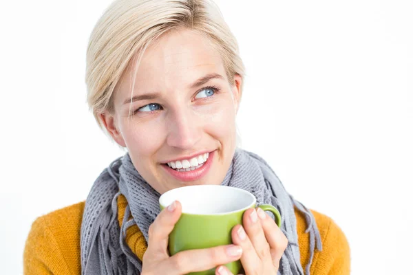 Woman drinking from a green cup — Stock Photo, Image