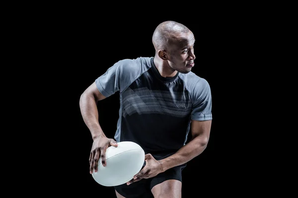 Atleta corriendo con pelota de rugby — Foto de Stock