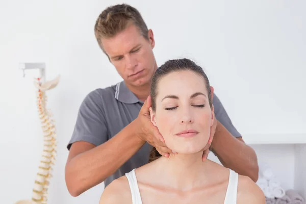 Doctor doing neck adjustment — Stock Photo, Image