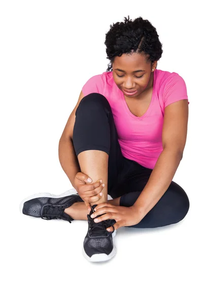 Fit woman with ankle injury — Stock Photo, Image